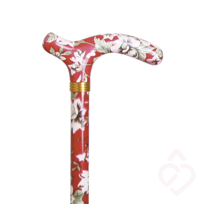 Punho vermelho com padrão floral e haste vermelha com flores brancas da bengala.