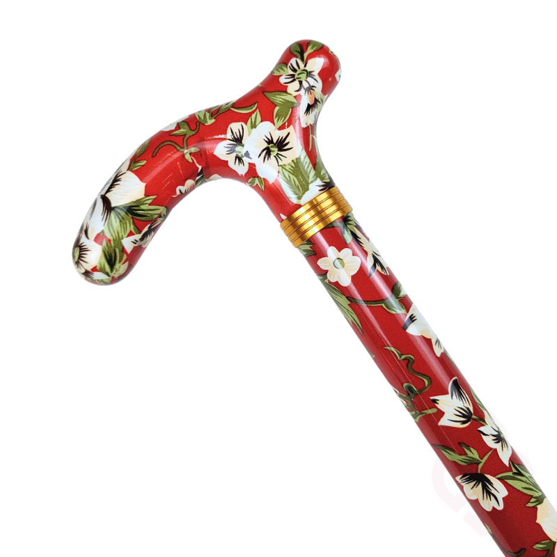 Punho vermelho com padrão floral e haste vermelha com flores brancas da bengala.