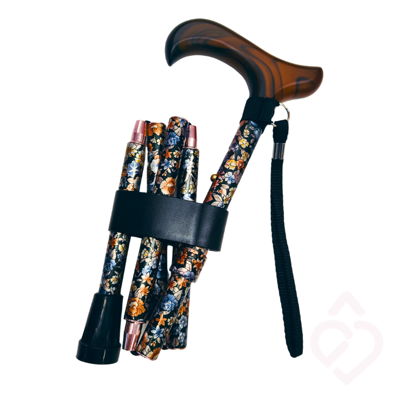 Bengala dobrável com padrão floral e cordão, compacta quando dobrada para facilitar o transporte e a arrumação.