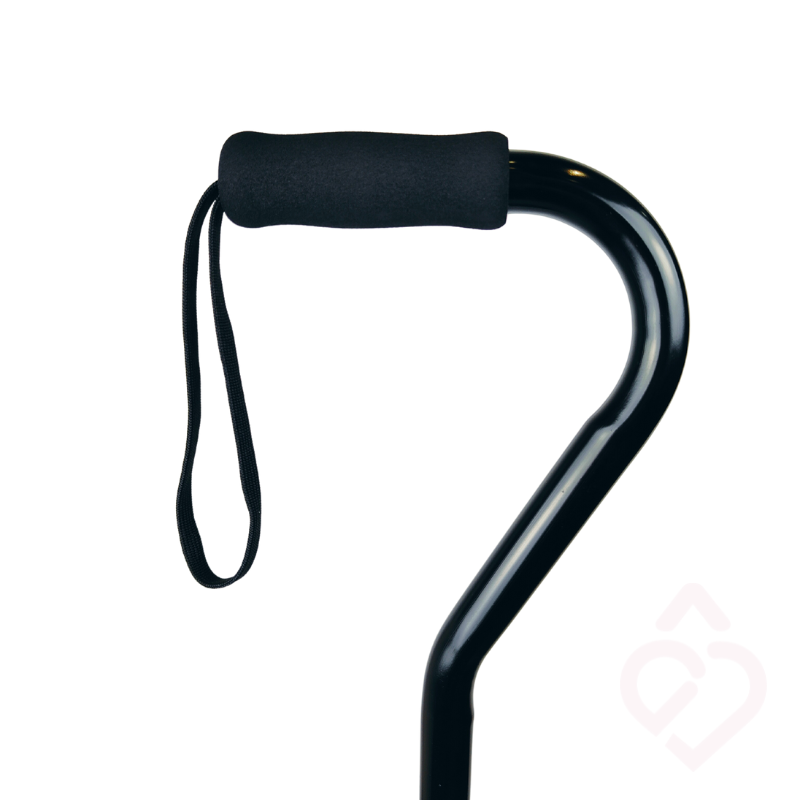 Pega da bengala quadripé preto, com revestimento macio para uma preensão mais confortável e correia de pulso que ajuda a manter a bengala segura e próxima do utilizador.