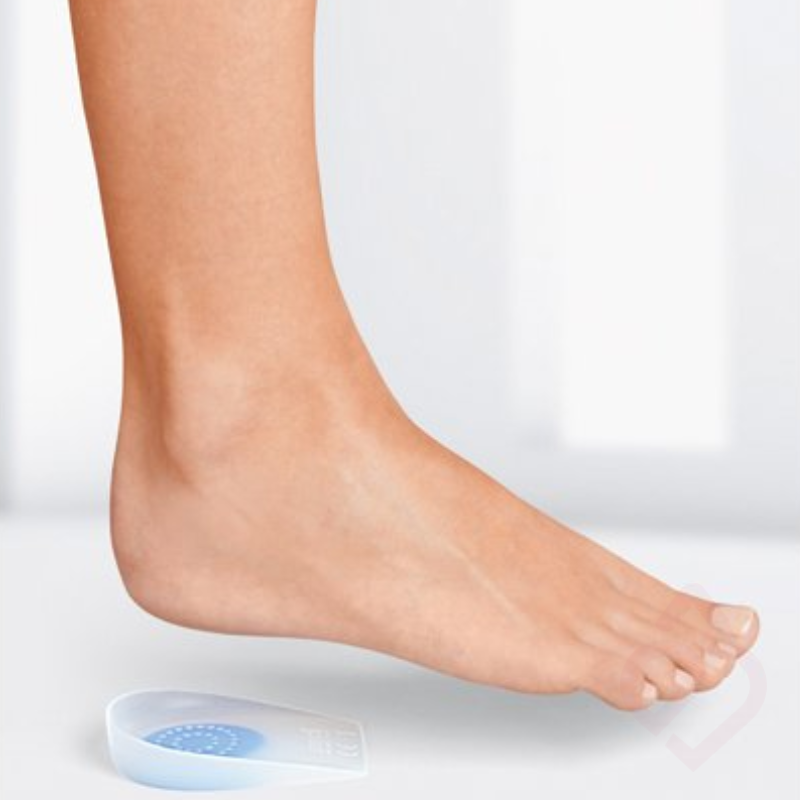 Talonete em silicone com zona central de amortecimento, concebido para aliviar a pressão no calcanhar e proporcionar maior conforto em casos de esporão do calcâneo.