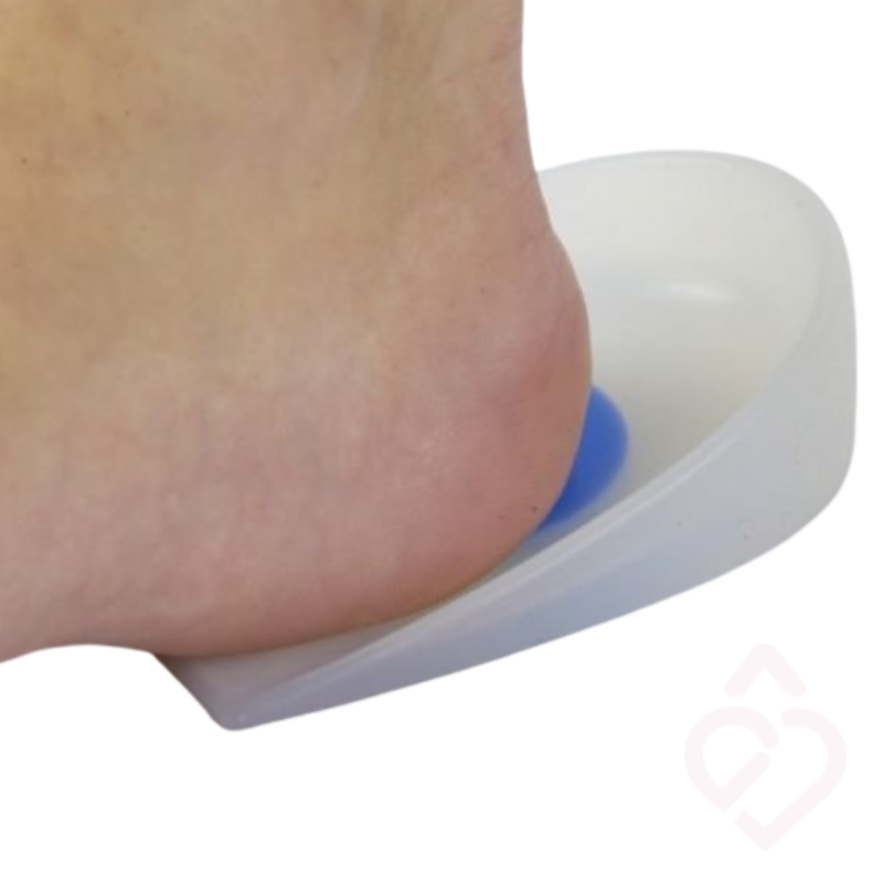 Talonete em silicone com zona central de amortecimento, concebido para aliviar a pressão no calcanhar e proporcionar maior conforto em casos de esporão do calcâneo.